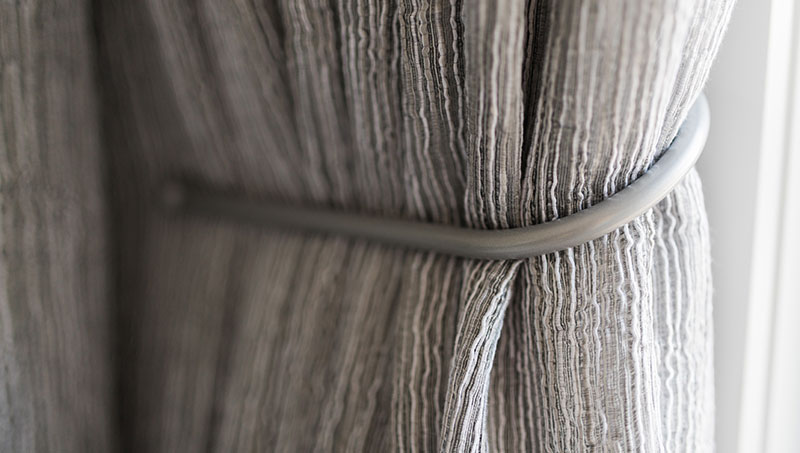 Abstract fabric texture closeup curtain hook