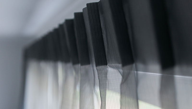 Black opaque drapes closeup