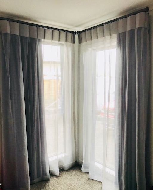 Opaque blinds in corner of bedroom