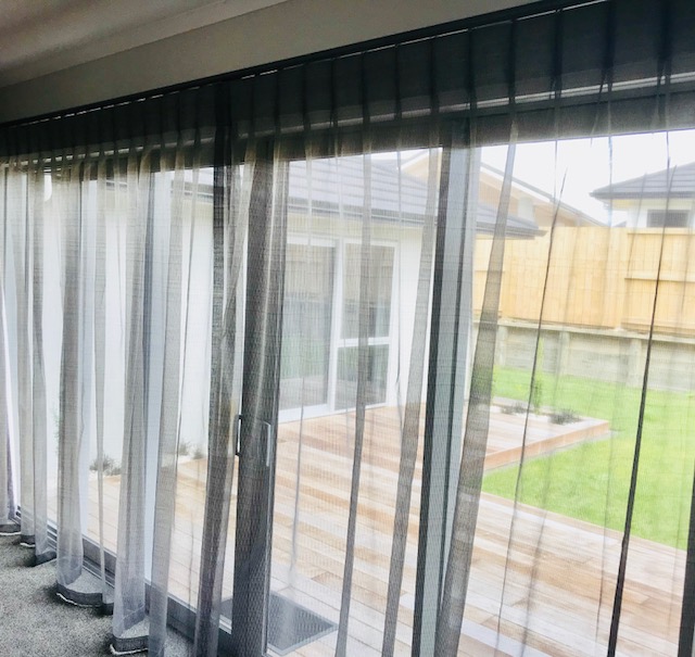 Ecoshade blinds behind sheer drapes