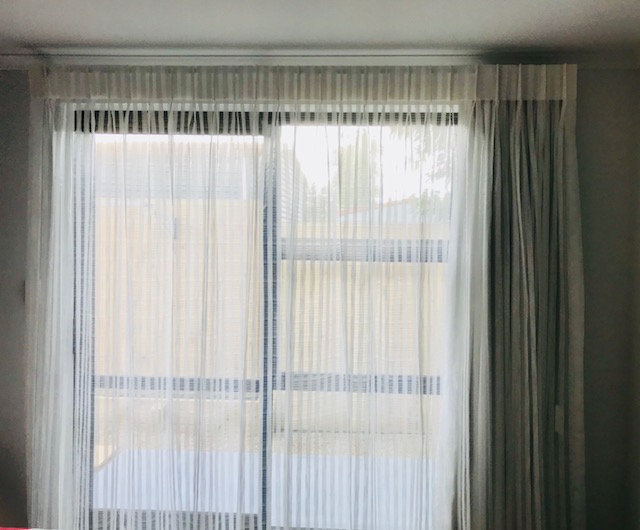 Opaque drapes in spare room