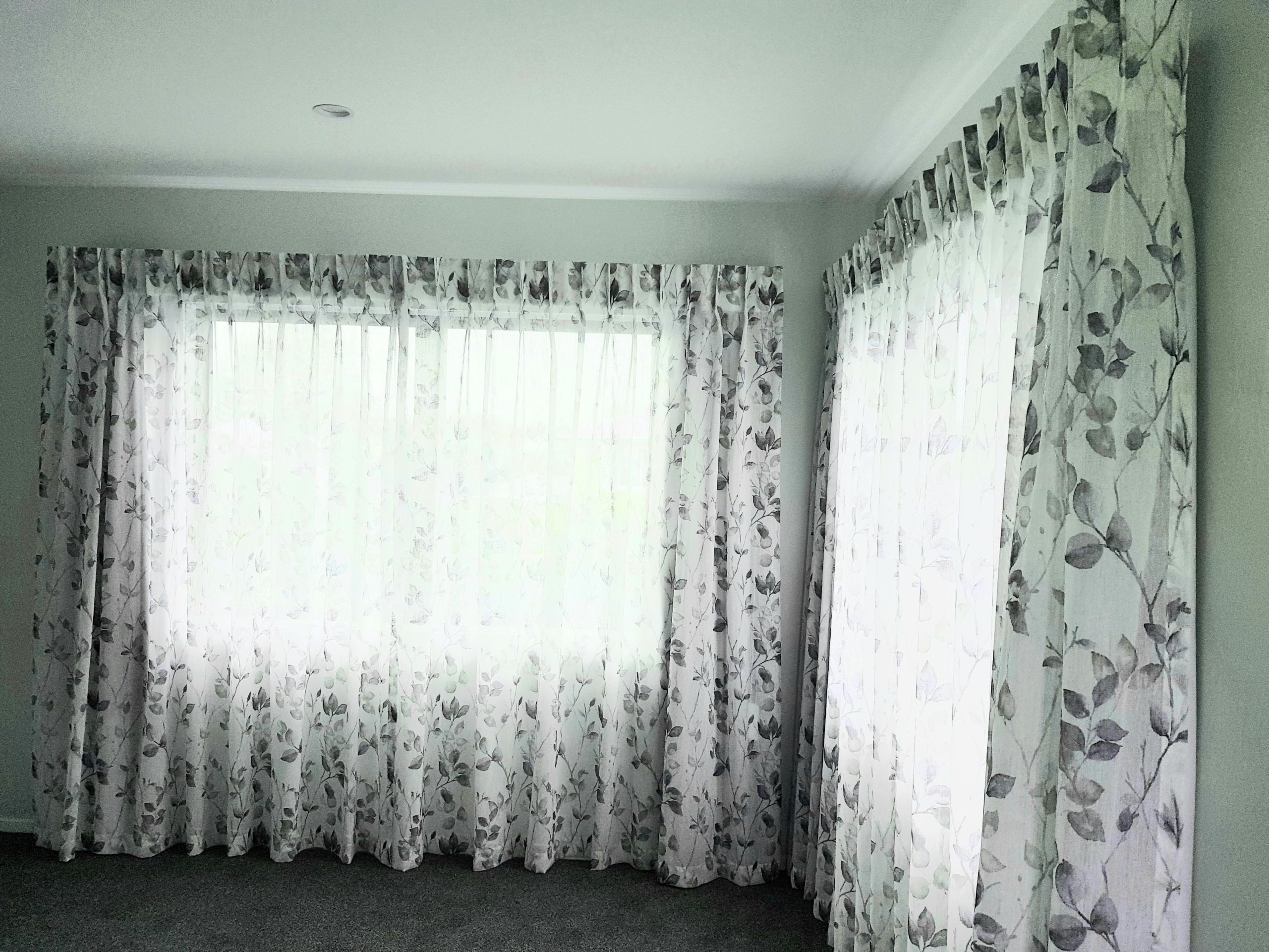Floral drapes in bed room